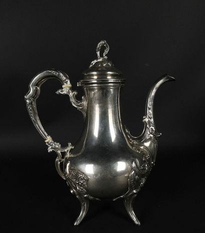 Coffee pot with four feet in silver decorated...