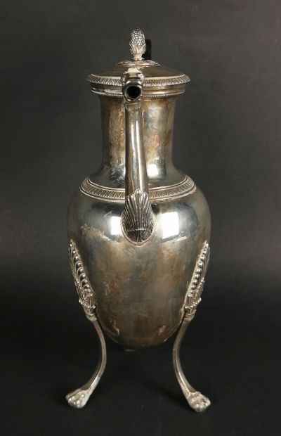 null Silver tripod pourer decorated with palmette friezes, the zoomorphic spout.
The...