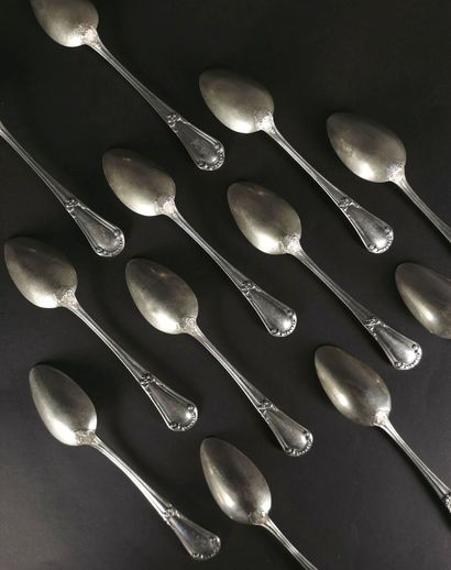 null Suite of twelve silver soup spoons with vegetal decoration, model engraved with...