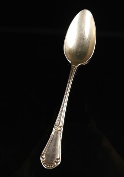 null Suite of twelve silver soup spoons with vegetal decoration, model engraved with...