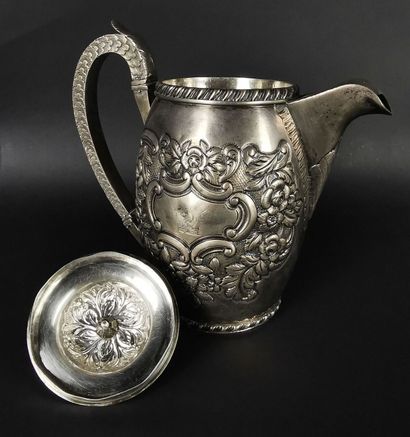 null Silver coffee pot with embossed and chased decoration of flowers, scrolls and...