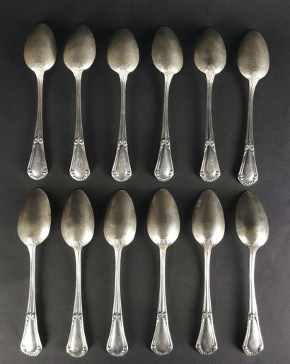 null Suite of twelve silver soup spoons with vegetal decoration, model engraved with...