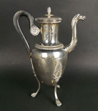 null Silver tripod pourer decorated with palmette friezes, the zoomorphic spout.
The...