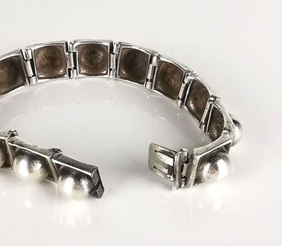 null H. TEGUY.
Articulated bracelet in Basque silver with square links adorned with...