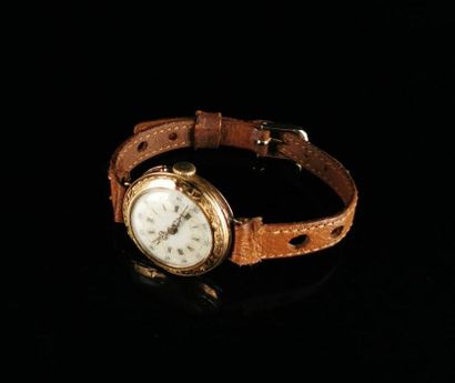 null Collar watch mounted on a yellow gold bracelet with chased plant decoration,...