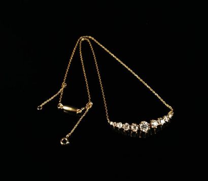 null Yellow gold necklace set with ten old-cut diamonds of various sizes, the largest...