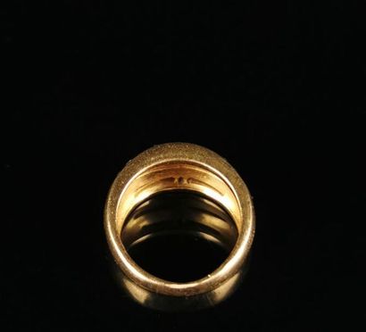 null Large yellow gold ring with triple lines of calibrated diamonds.
Finger size:...