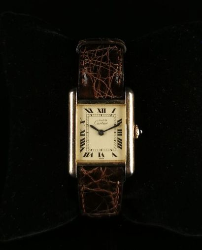 null Must from CARTIER.
Ladies' tank bracelet watch in vermeil.
Enameled dial with...