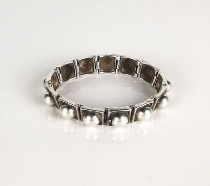 null H. TEGUY.
Articulated bracelet in Basque silver with square links adorned with...