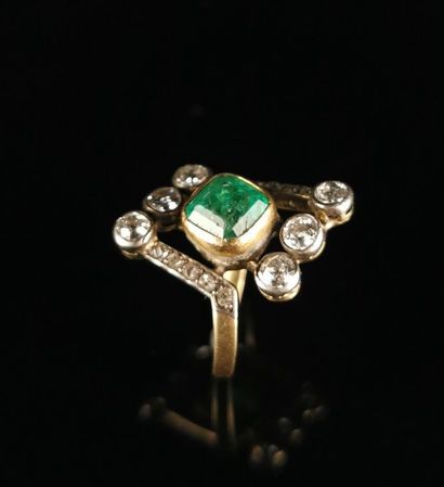 null Yellow gold and silver asymmetrical ring set with an emerald and six brilliant-cut...