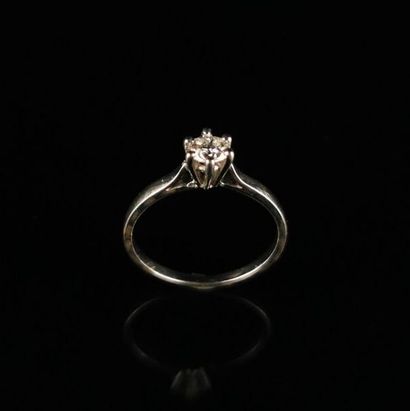 null White gold solitaire ring set with a brilliant-cut diamond weighing approx....