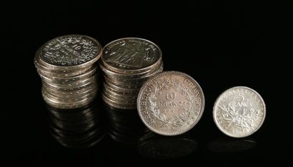 null Twenty-five silver coins including :
- twenty-four 10-franc Hercules coins,
-...