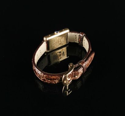 null Must from CARTIER.
Ladies' tank bracelet watch in vermeil.
Enameled dial with...