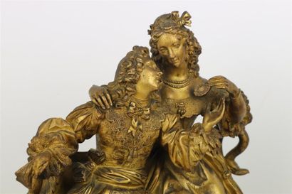 null Pendule en bronze doré à décor d'un couple de galants, le cadran signé de Genty...