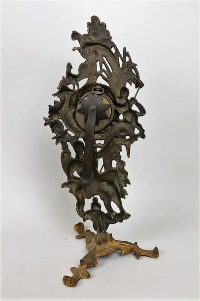 null Porte-montre en bronze ciselé et doré figurant Chronos.

Travail du XVIIIème...