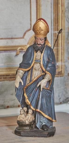 null Statuette en bois polychrome représentant Saint Nicolas ; à ses pieds, les enfants...