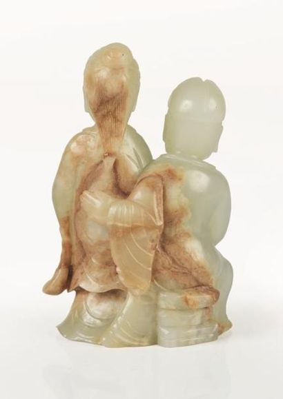 null CHINE.

Groupe en jade céladon sculpté représentant un couple se tenant par...