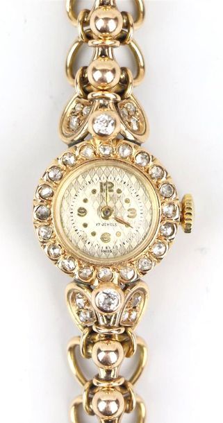 null Montre en or jaune et diamants, le cadran marqué "SWISS", le bracelet à maillons...