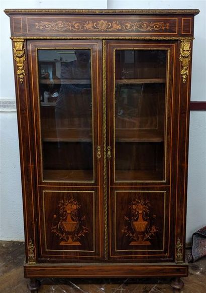 null LOW LIBRARY in mahogany veneer opening to two doors on the front, decorated...