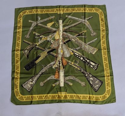 null HERMES PARIS - "Diane" Silk square printed with firearms decoration on a green...