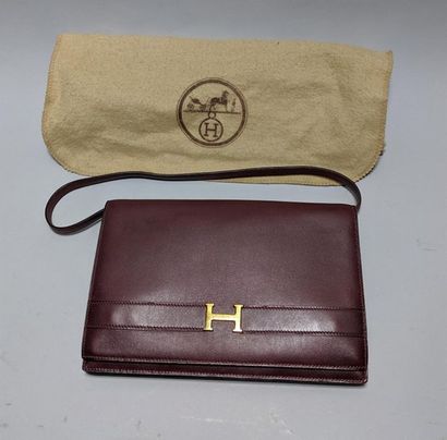 null HERMES PARIS - Purple leather clutch, gold metal H clasp with shoulder strap...