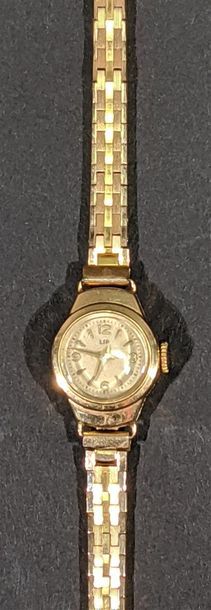 null LIP - Montre bracelet de dame en or jaune 18 K (750/oo), le cadran rond à fond...