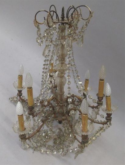 null Chandelier with gilt bronze structure illuminating nine arms of lights around...