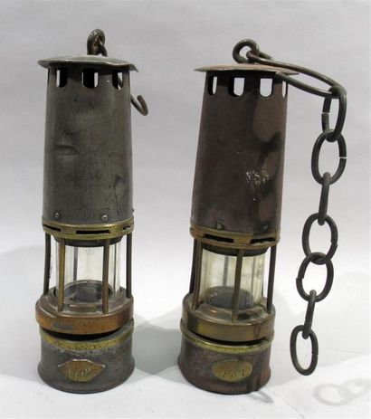 null MEETING OF TWO MINOR LAMPS with plates numbered 1448 and 846 and their glass...