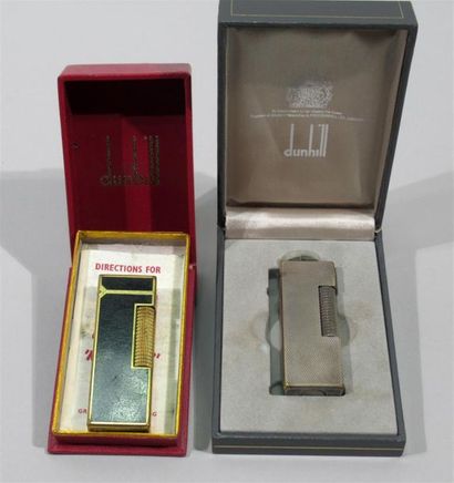 null DUNHILL - Two lighters, one in gold metal and black lacquered, the other in...