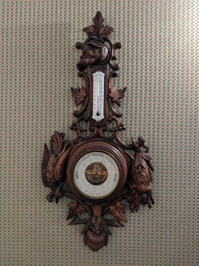 null BAROMETER-THERMOMETER in stained beech wood with carved decoration of hunting...