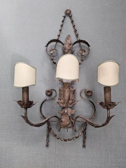 null Pair of grey patinated metal sconces with three light arms, decorated with falling...