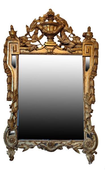 null Rectangular MIRROR in gilded and stuccoed wood, decorated with an urn in a frame...