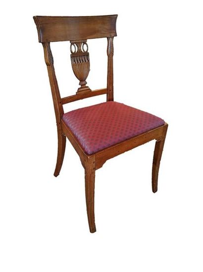 null SUITE OF FIVE CHAIRS in fruit wood with carved openwork backrests of a Directoire...