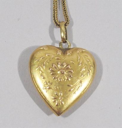 null Pendentif porte-souvenir "Coeur" en or jaune 18 K (750/oo) retenu par une chaîne...