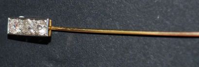 null 18 K (750/oo) yellow gold hatpin set with three antique cut diamonds each approximately...