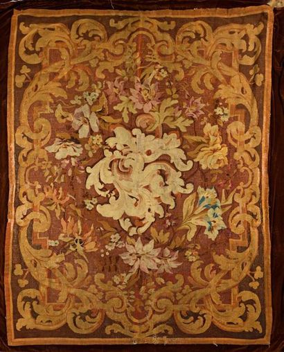 null TAPESTRY with decoration of foliated foliage and flowers on a wine-lees background...