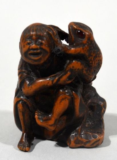 null Boxwood Netsuke with inlaid brown horn of Gama Sennin who according to the legend...