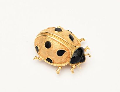 null HERMES PARIS
"Ladybird" brooch in 18 K (750/oo) yellow gold and onyx. 
Signed
Gross...