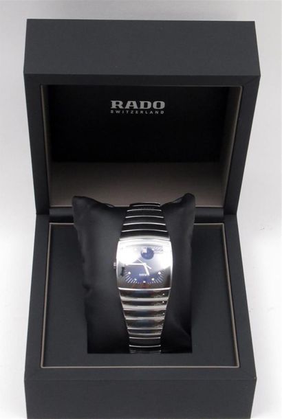 null RADO
Men's chronograph watch in ceramic, tonneau case with night-blue dial with...