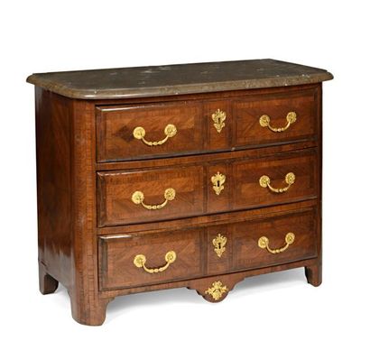 null Parisian chest of drawers in amaranth and rosewood veneer opening by three drawers...