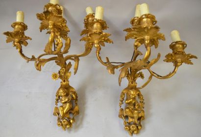 null Pair of chased and gilt bronze wall lights with four arms. The shaft representing...