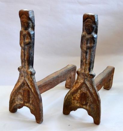 null Pair of cast iron CHENETS representing wild men with clubs and a hug.
Work probably...