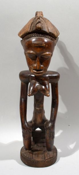 null STATUETTE féminine en bois sculpté.
Travail Baoulé, Cote d'Ivoire.
(Usures)
Hauteur...