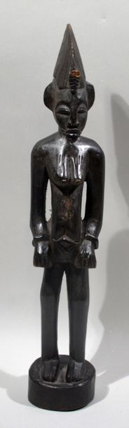 null STATUETTE féminine en bois sculpté.
Travail Sénoufo, Cote d'Ivoire.
(Usures)
Hauteur...