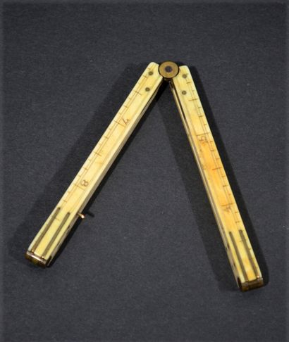null RULES in inches and centimetres in ivory trimmed with brass. 

Late 18th-early...