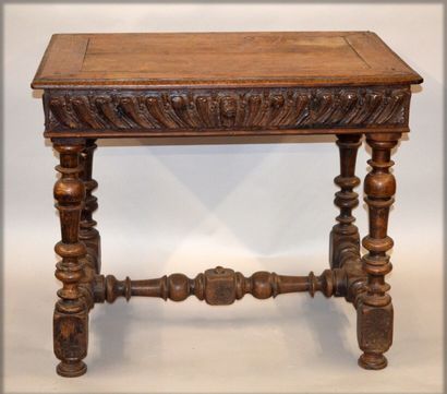 null Moulded and carved oak cabaret table. It opens with a drawer on the front and...