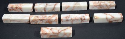 null Suite of nine knife holders in white marble veined with ochre (restorations...