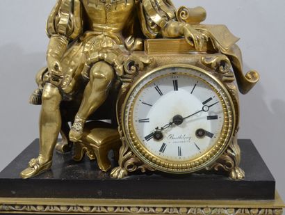 null Clock in bronze with a gilded patina and black marble, surmounted by a subject...