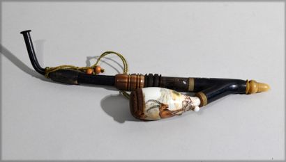 null Ebony and horn PIPE, porcelain tank with painted decoration of an ibex.

Probably...