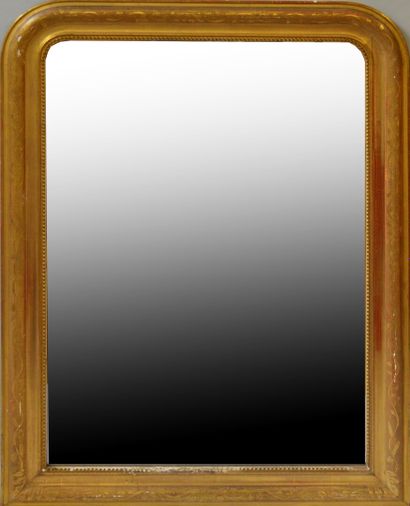 null Large mantel mirror with gilded and stuccoed wood frame adorned with a frieze...